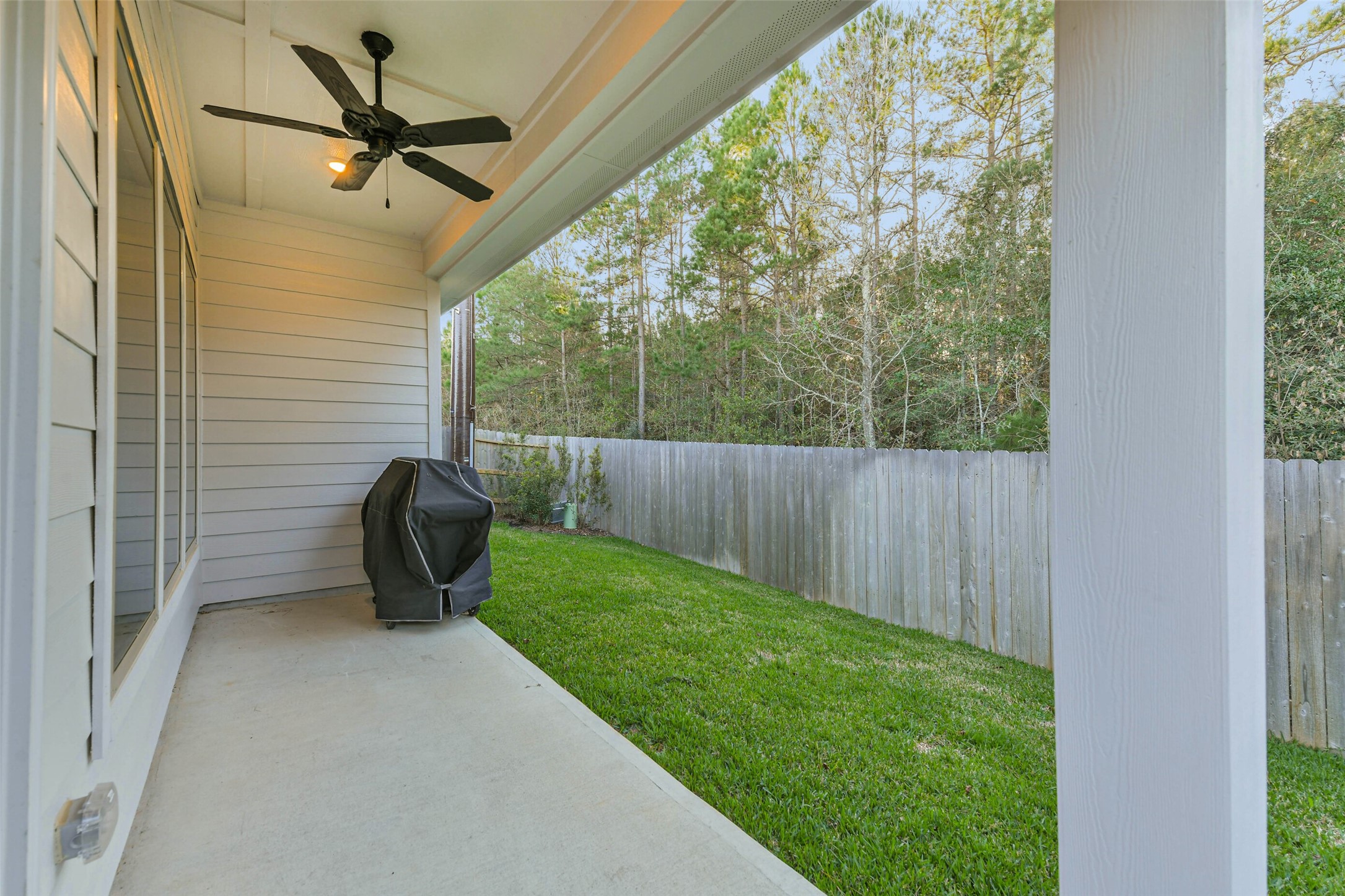 1337 Lakeside Crk Road Magnolia, TX 77354 - Photo 31 of 34 a view of a porch with furniture and a yard