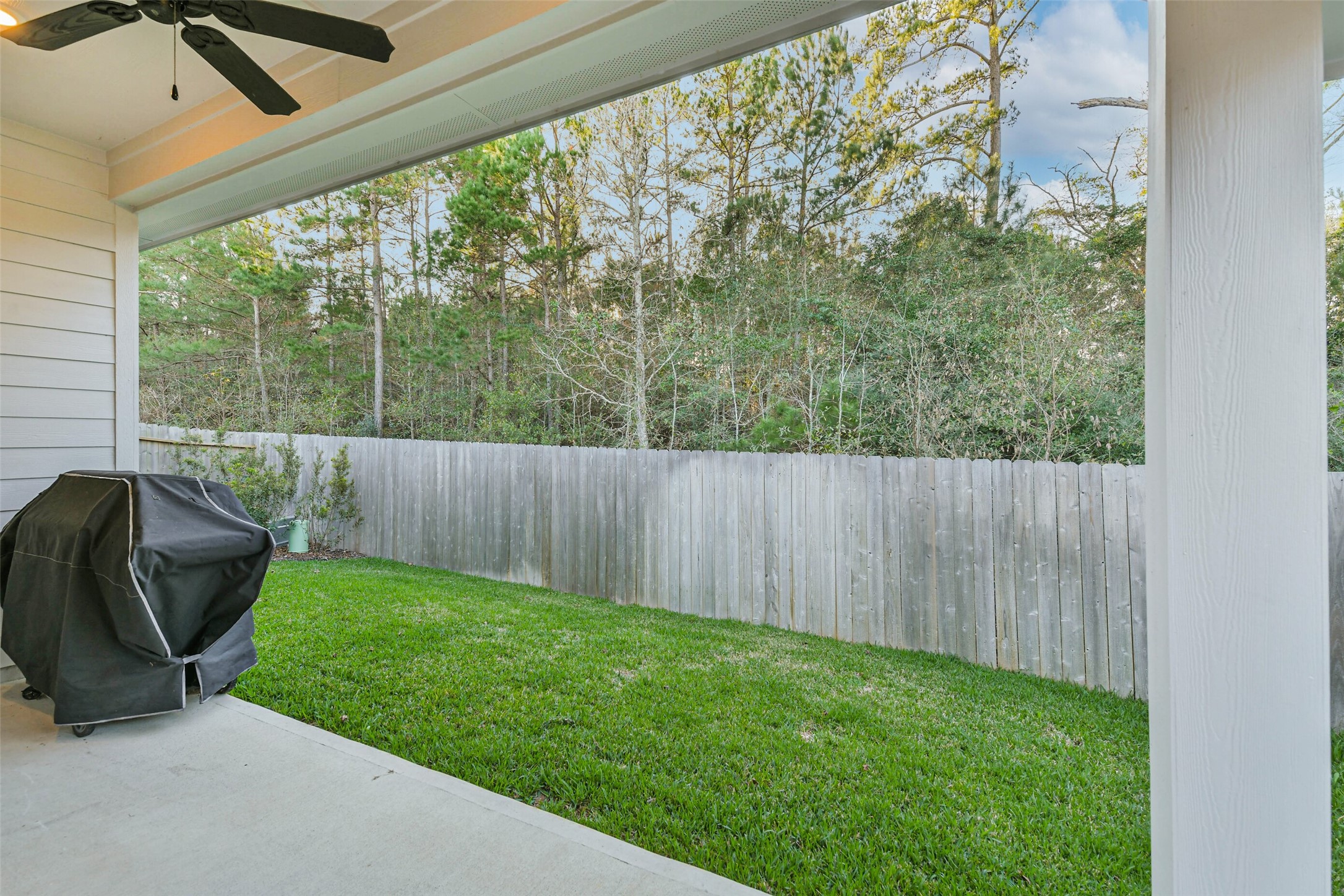 1337 Lakeside Crk Road Magnolia, TX 77354 - Photo 33 of 34 a view of a backyard with furniture and garden
