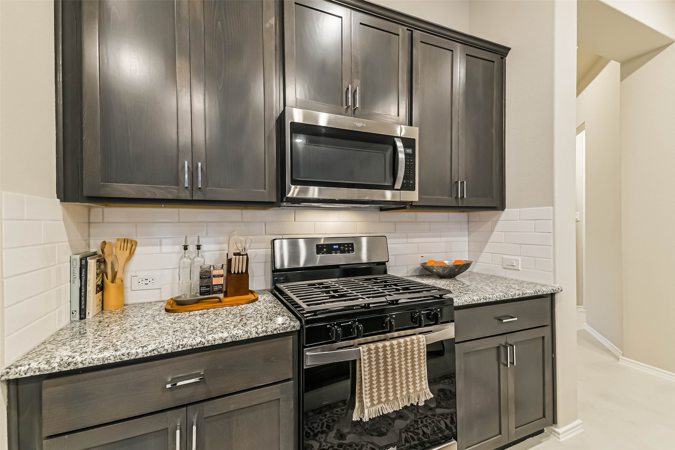 1337 Lakeside Crk Road Magnolia, TX 77354 - Photo 7 of 34 a kitchen with granite countertop stainless steel appliances and cabinets