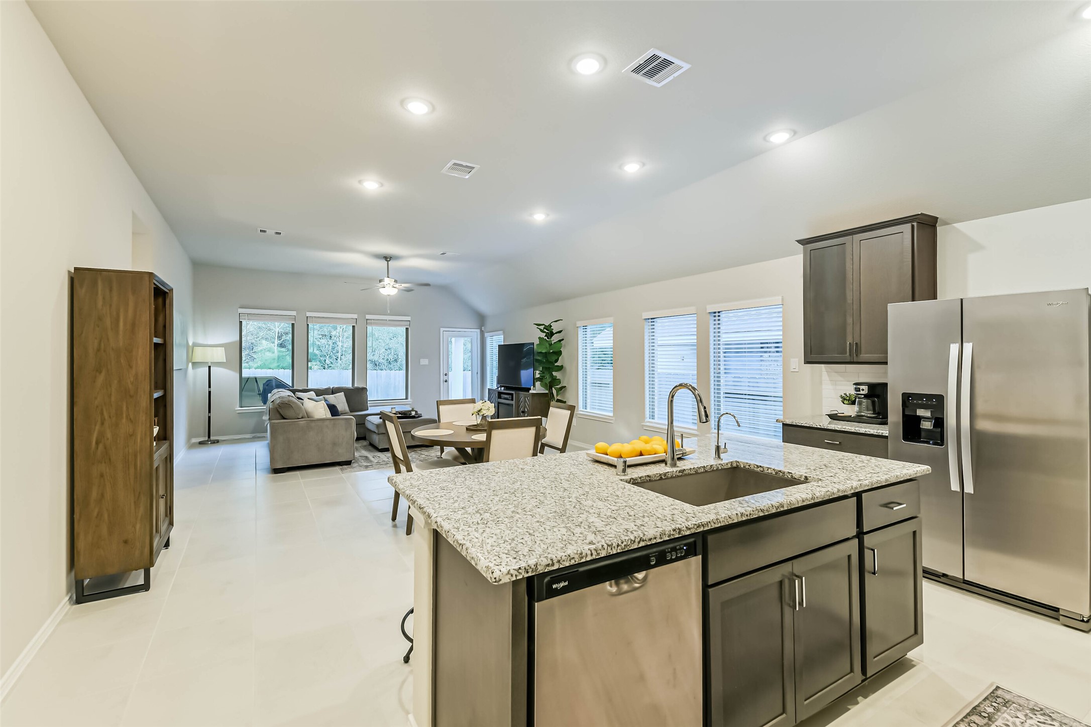 1337 Lakeside Crk Road Magnolia, TX 77354 - Photo 8 of 34 a kitchen with sink refrigerator and microwave