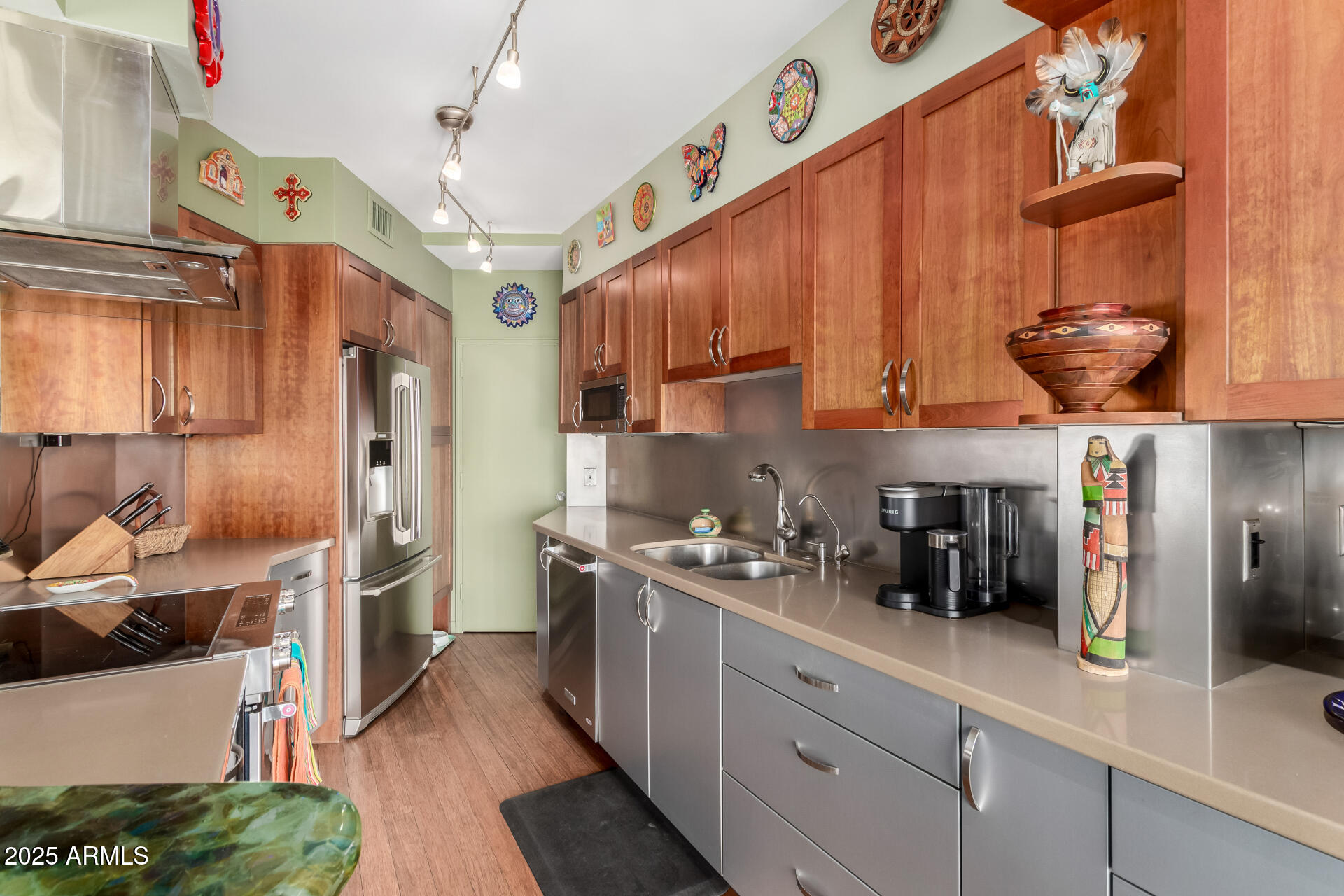 2201 North Central Avenue, Unit 5B Phoenix, AZ 85004 - Photo 12 of 35 a kitchen with stainless steel appliances granite countertop a sink a stove and a refrigerator