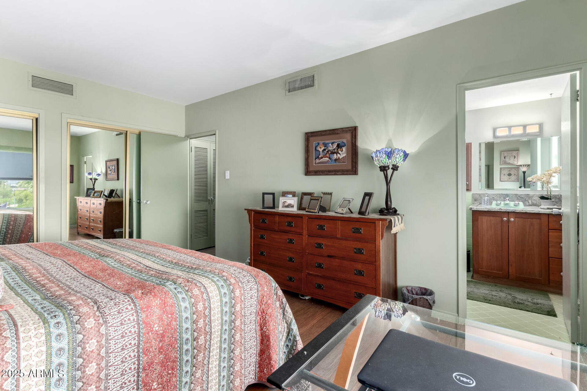 2201 North Central Avenue, Unit 5B Phoenix, AZ 85004 - Photo 15 of 35 a room with a bed and a mirror