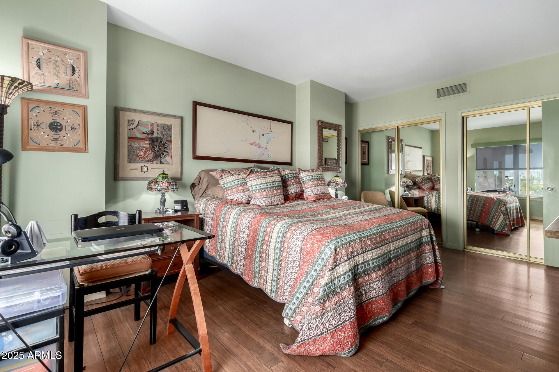 2201 North Central Avenue, Unit 5B Phoenix, AZ 85004 - Photo 16 of 35 a bedroom with a bed and wooden floor