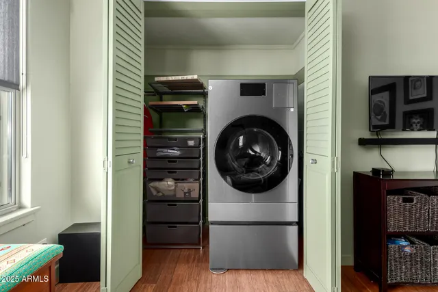 a view of a hallway with washer and dryer