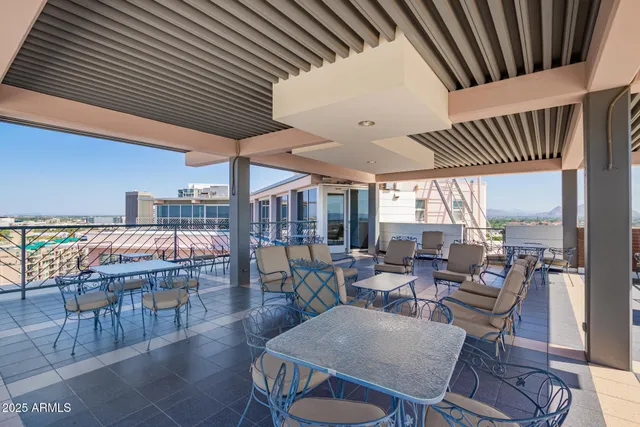a dining room with furniture wooden floor and a rug