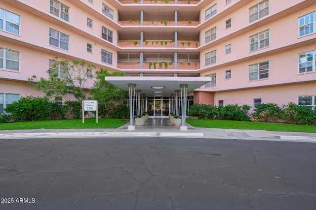 a view of a building with a yard