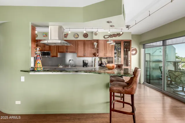 a living room with a table or chairs and a wooden floor