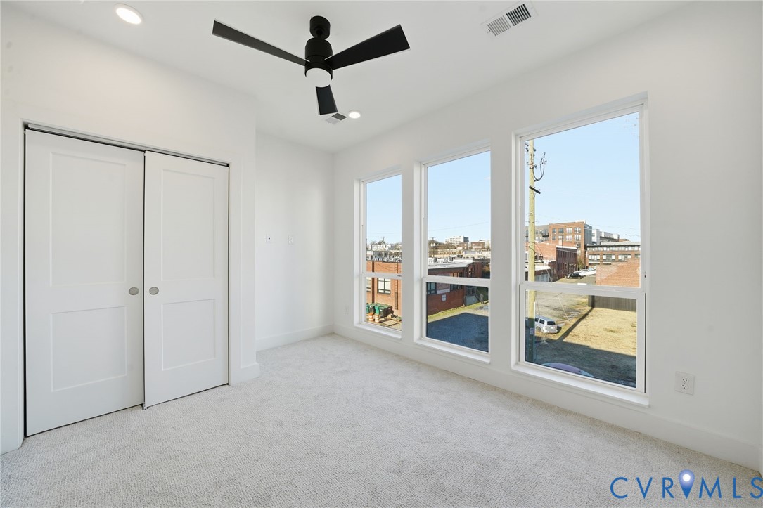112 Manchester Road Richmond, VA 23224 - Photo 13 of 21 Spacious bedroom showcasing pristine carpet floori