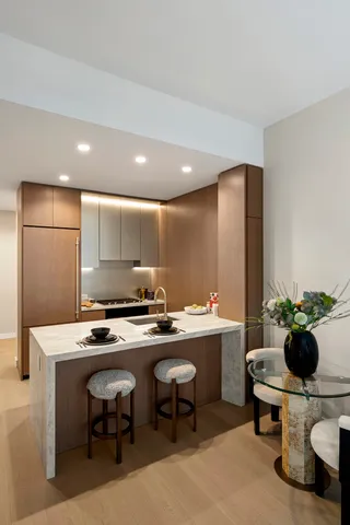 a living room with furniture a table and a large window