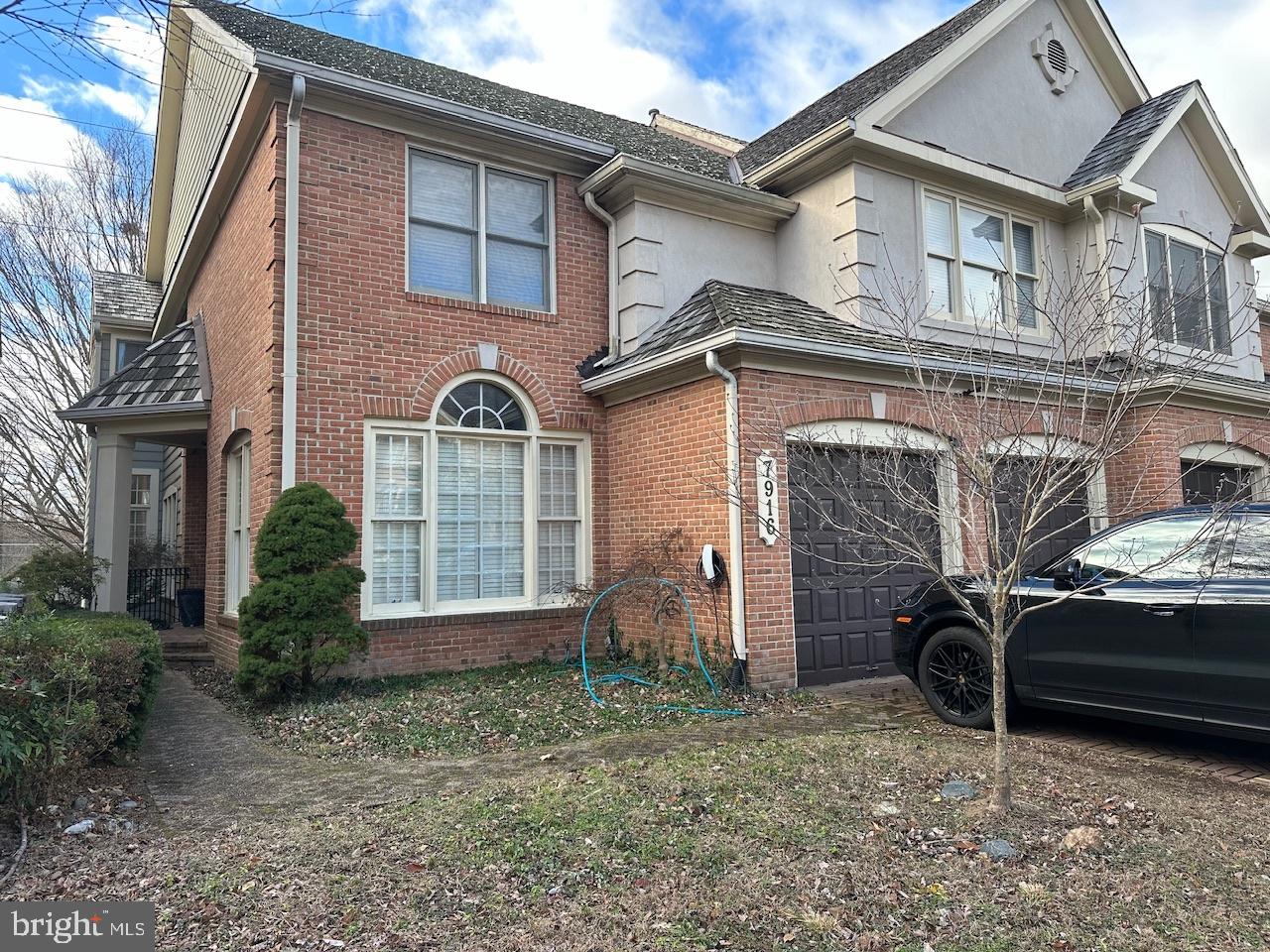 7916 Turncrest Drive Potomac, MD 20854 - Photo 2 of 2 a front view of a house with parking space
