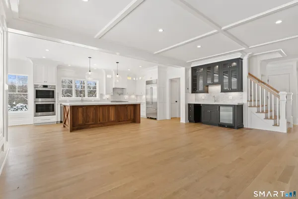 a view of kitchen with furniture and a fireplace