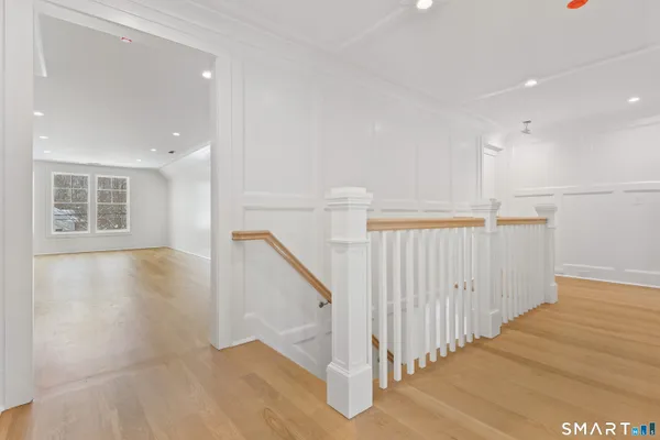 a view of a hallway with staircase