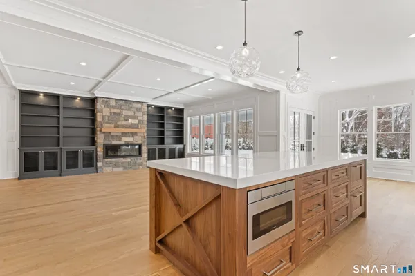 a kitchen with stainless steel appliances granite countertop a stove and cabinets