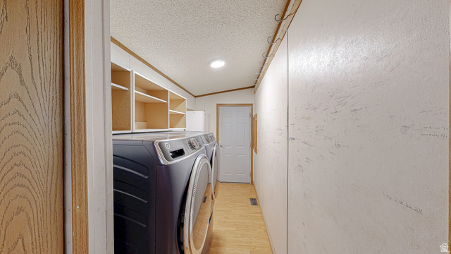718 South State Street Genola, UT 84655 - Photo 16 of 19 Laundry area featuring wood-finish flooring, overhead shelving, and a recessed ceiling light