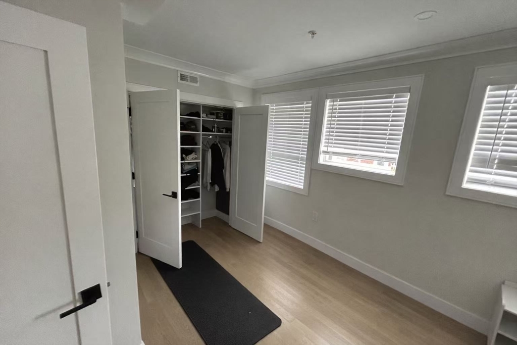 13 Greylock Road, Unit 3 Boston, MA 02134 - Photo 5 of 10 a view of walk in closet with empty racks