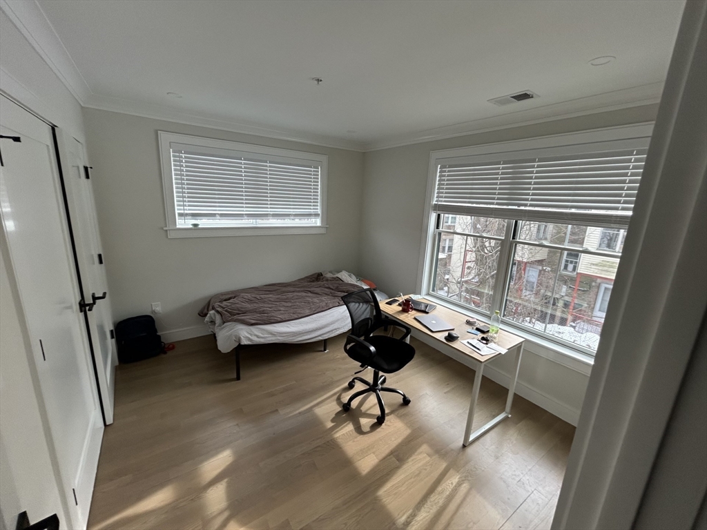 13 Greylock Road, Unit 3 Boston, MA 02134 - Photo 6 of 10 a room with furniture and windows