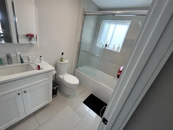 a view of a hallway with washer and dryer