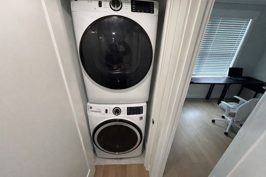 13 Greylock Road, Unit 3 Boston, MA 02134 - Photo 9 of 10 a view of a hallway with washer and dryer