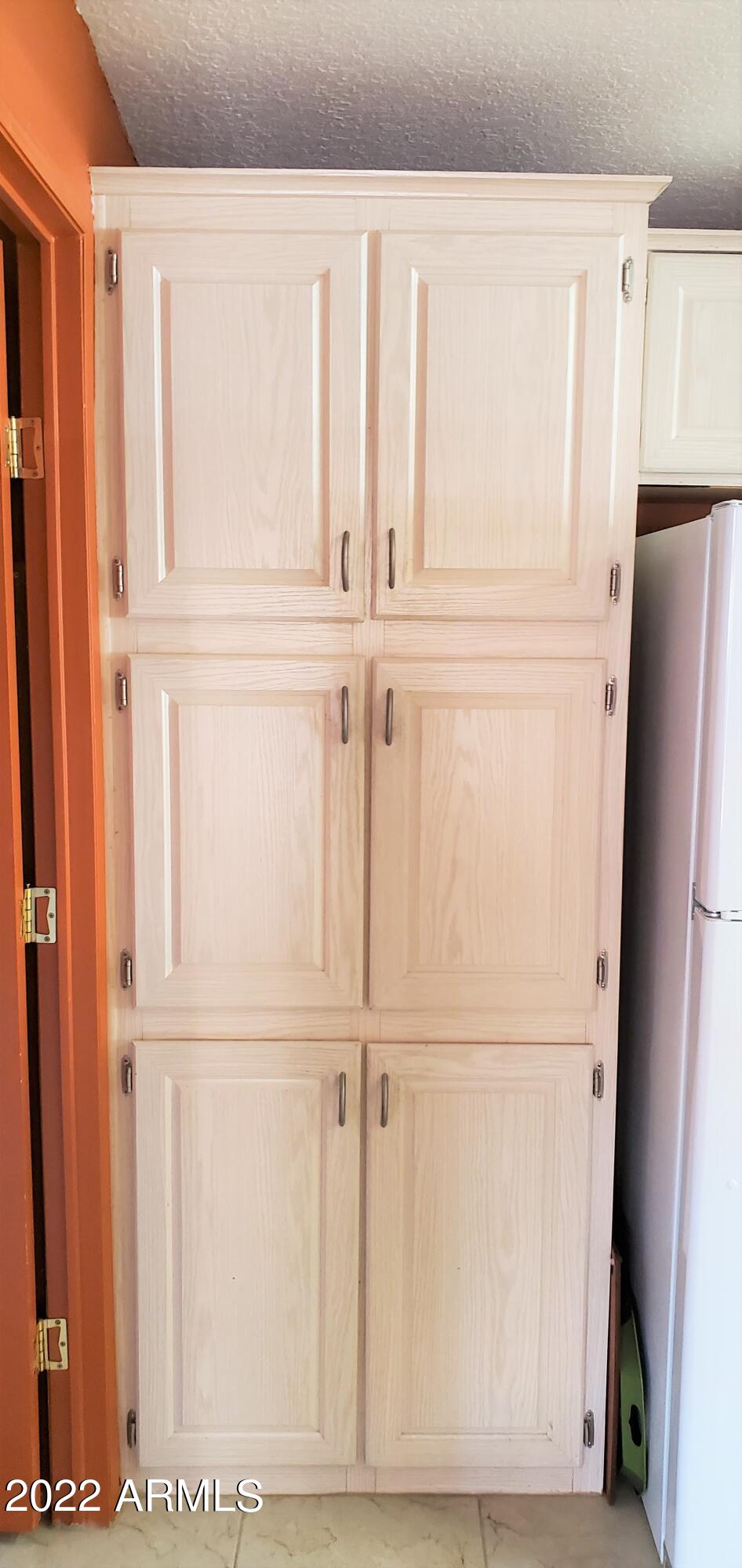 11201 North El Mirage Road, Unit A22 El Mirage, AZ 85335 - Photo 17 of 41 Kitchen Pantry Cabinets