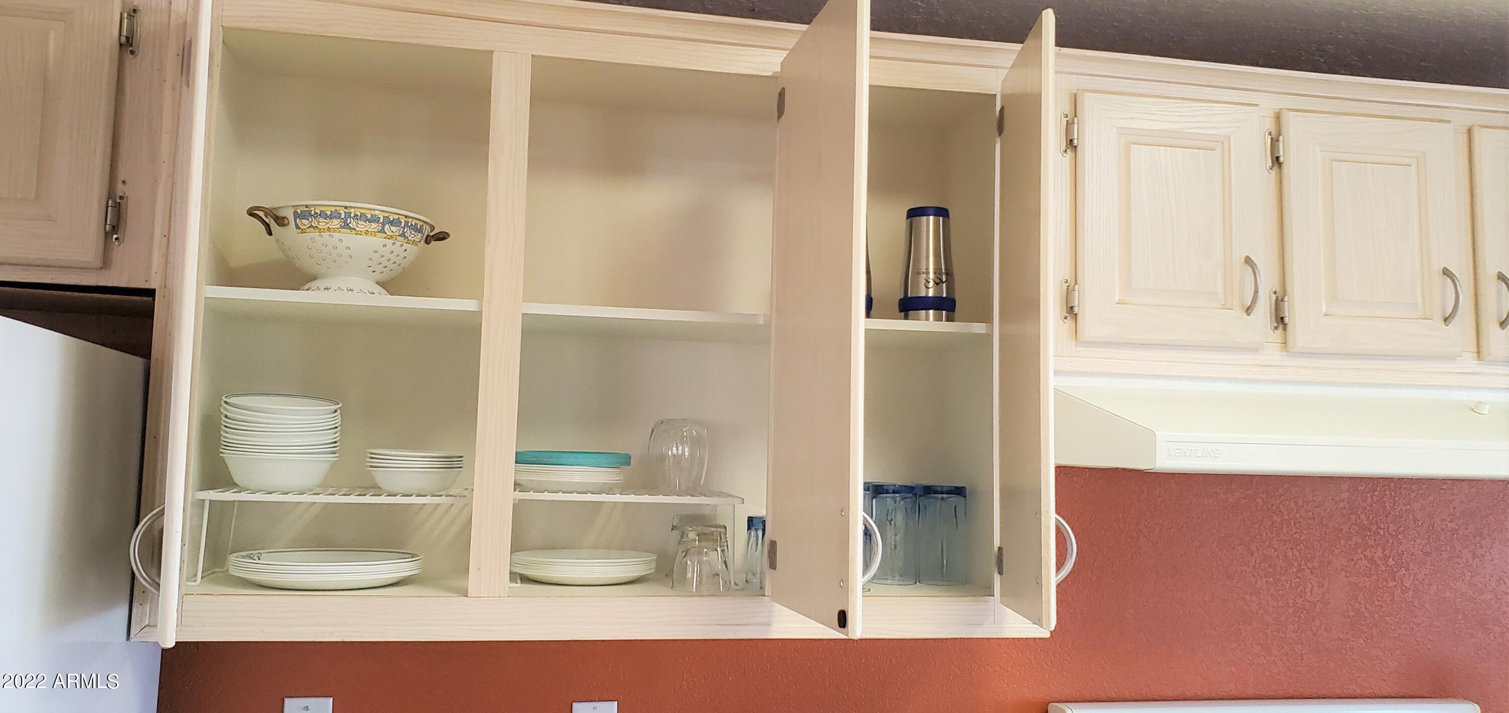 11201 North El Mirage Road, Unit A22 El Mirage, AZ 85335 - Photo 18 of 41 Upper Cabinets w Dishes