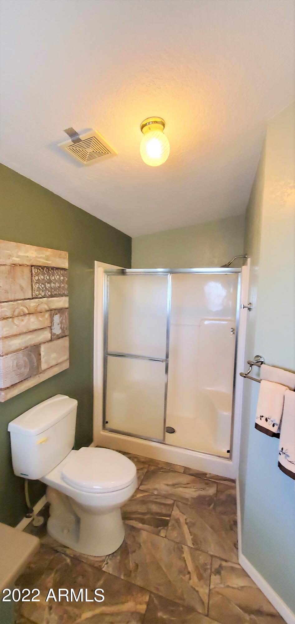 11201 North El Mirage Road, Unit A22 El Mirage, AZ 85335 - Photo 21 of 41 Master Bathroom Shower & Toilet