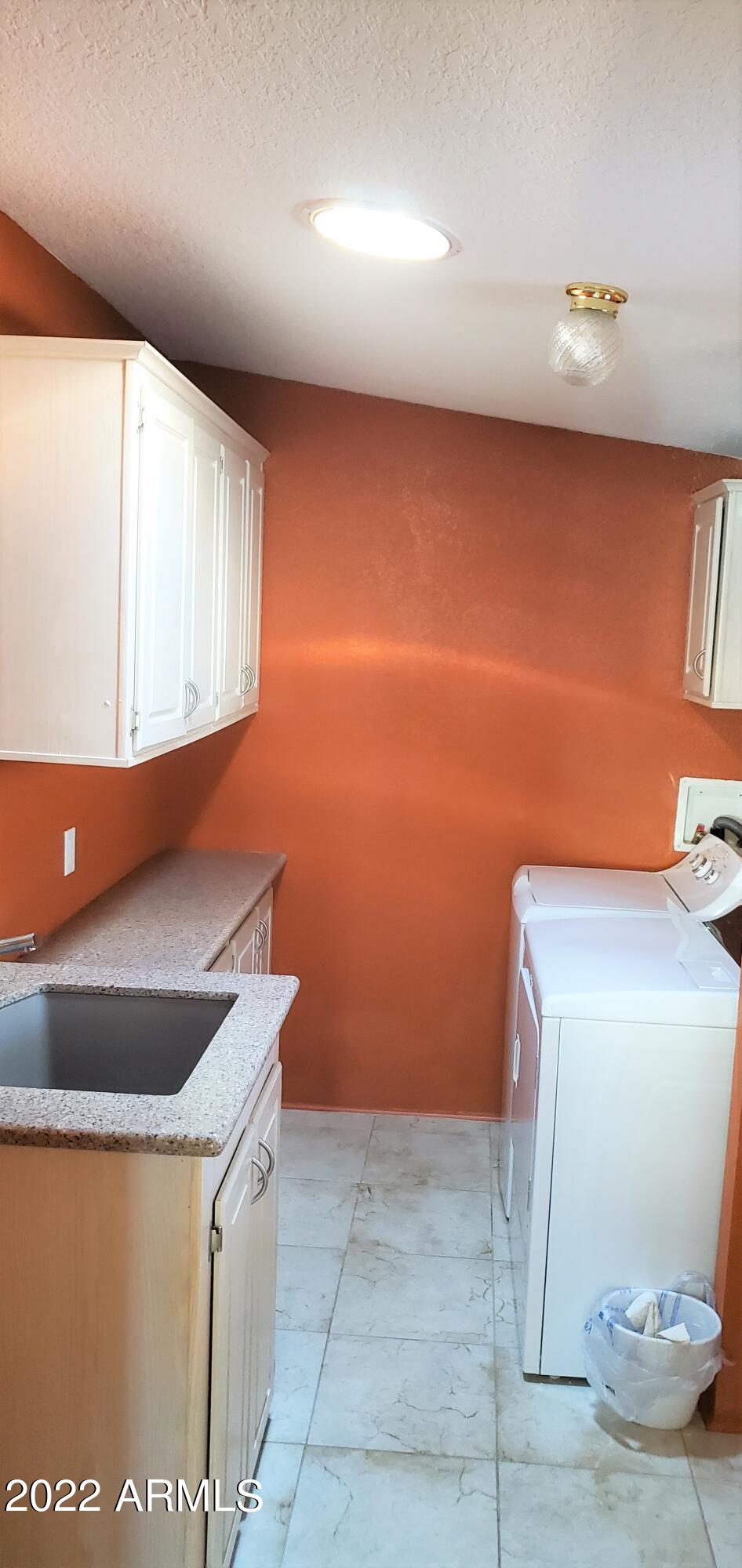 11201 North El Mirage Road, Unit A22 El Mirage, AZ 85335 - Photo 26 of 41 Inside Laundry Rm w Sink