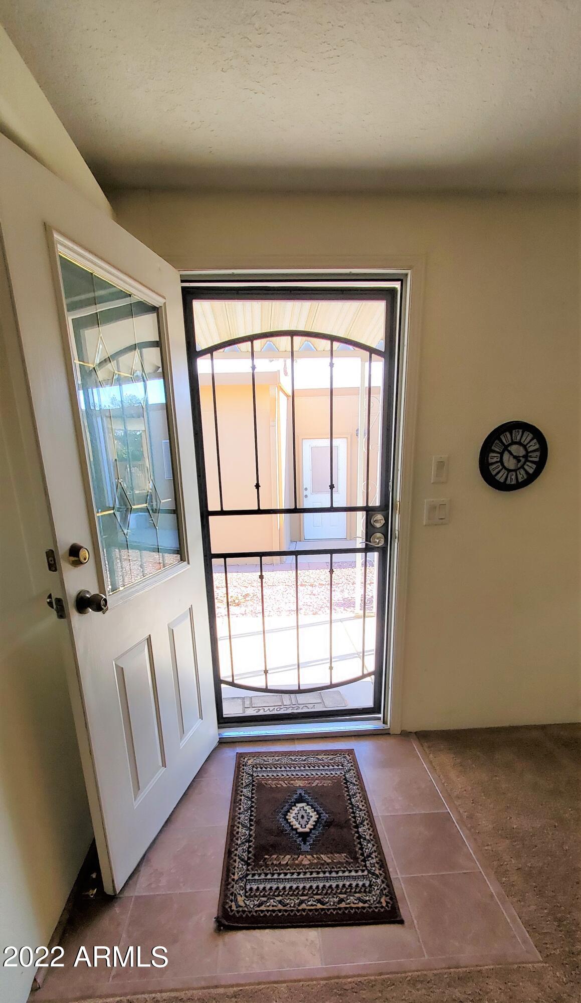 11201 North El Mirage Road, Unit A22 El Mirage, AZ 85335 - Photo 9 of 41 Front Door w Iron Screen Door