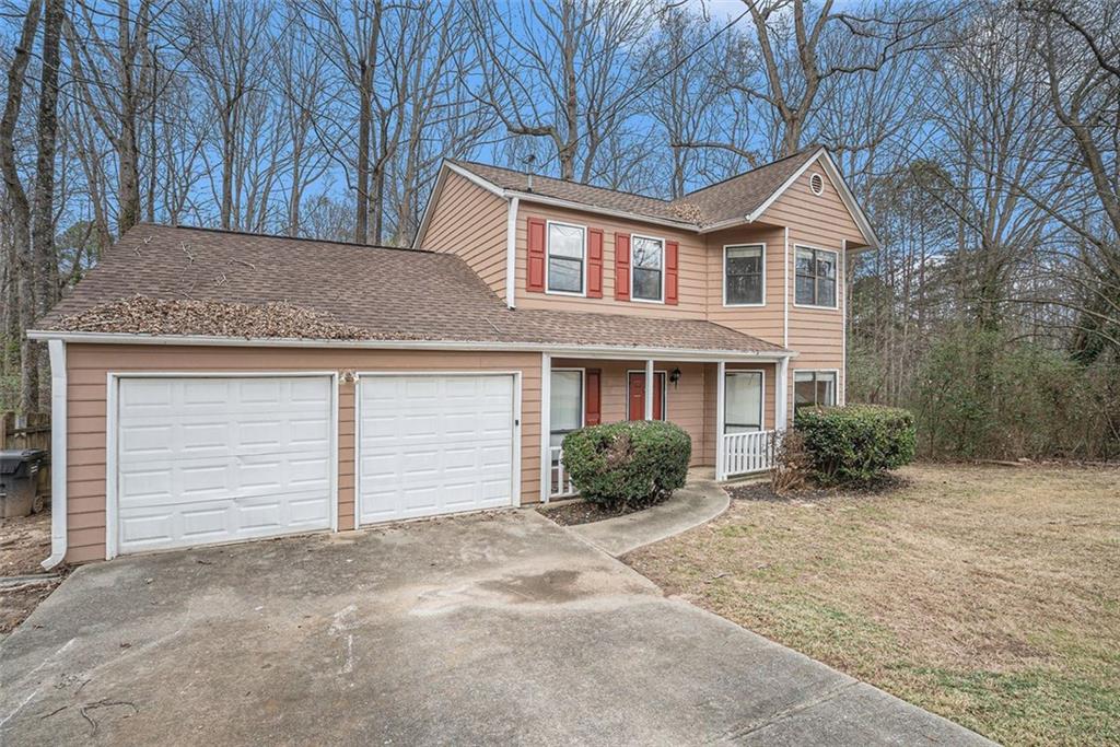 190 Cottonpatch Road Lawrenceville, GA 30046 - Photo 1 of 1 a front view of a house with a yard and garage