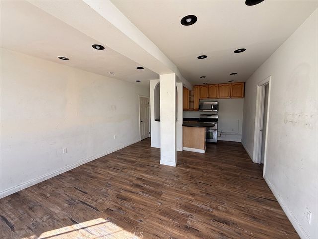 a view of kitchen with wooden floor