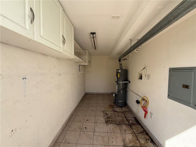 a storage room with wooden cabinets