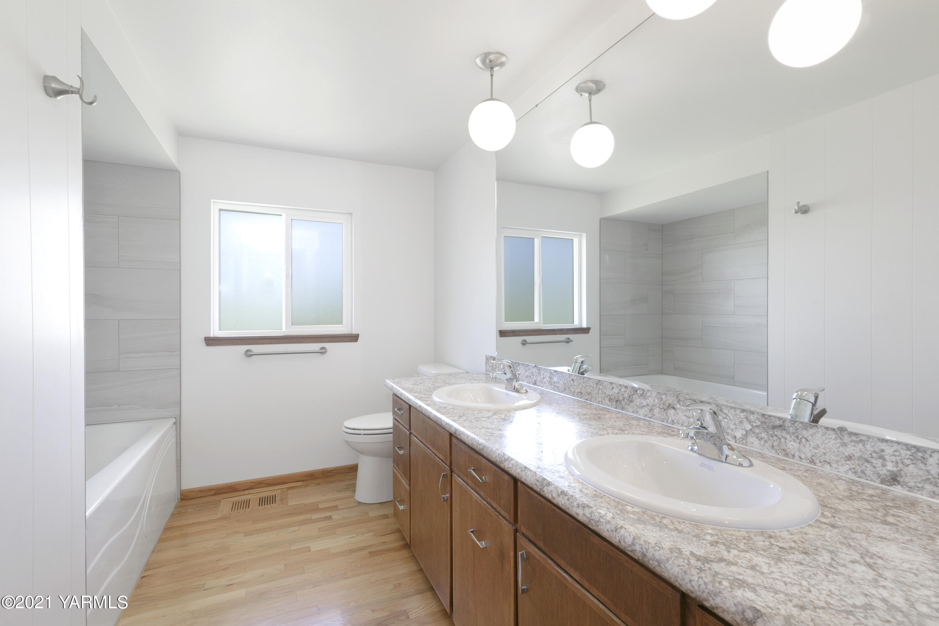 413 Wendt Road Yakima, WA 98901 - Photo 12 of 24 a bathroom with a granite countertop sink and a mirror
