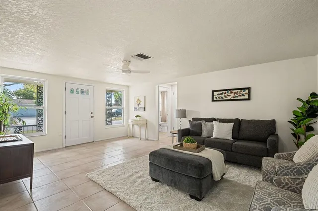 a spacious bedroom with a large bed and a dresser