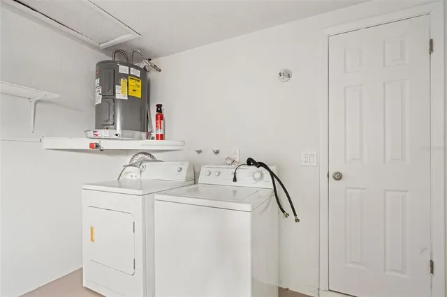 a view of backyard of house and entertaining space