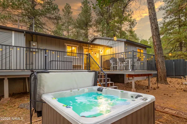 a view of house with swimming pool outdoor seating
