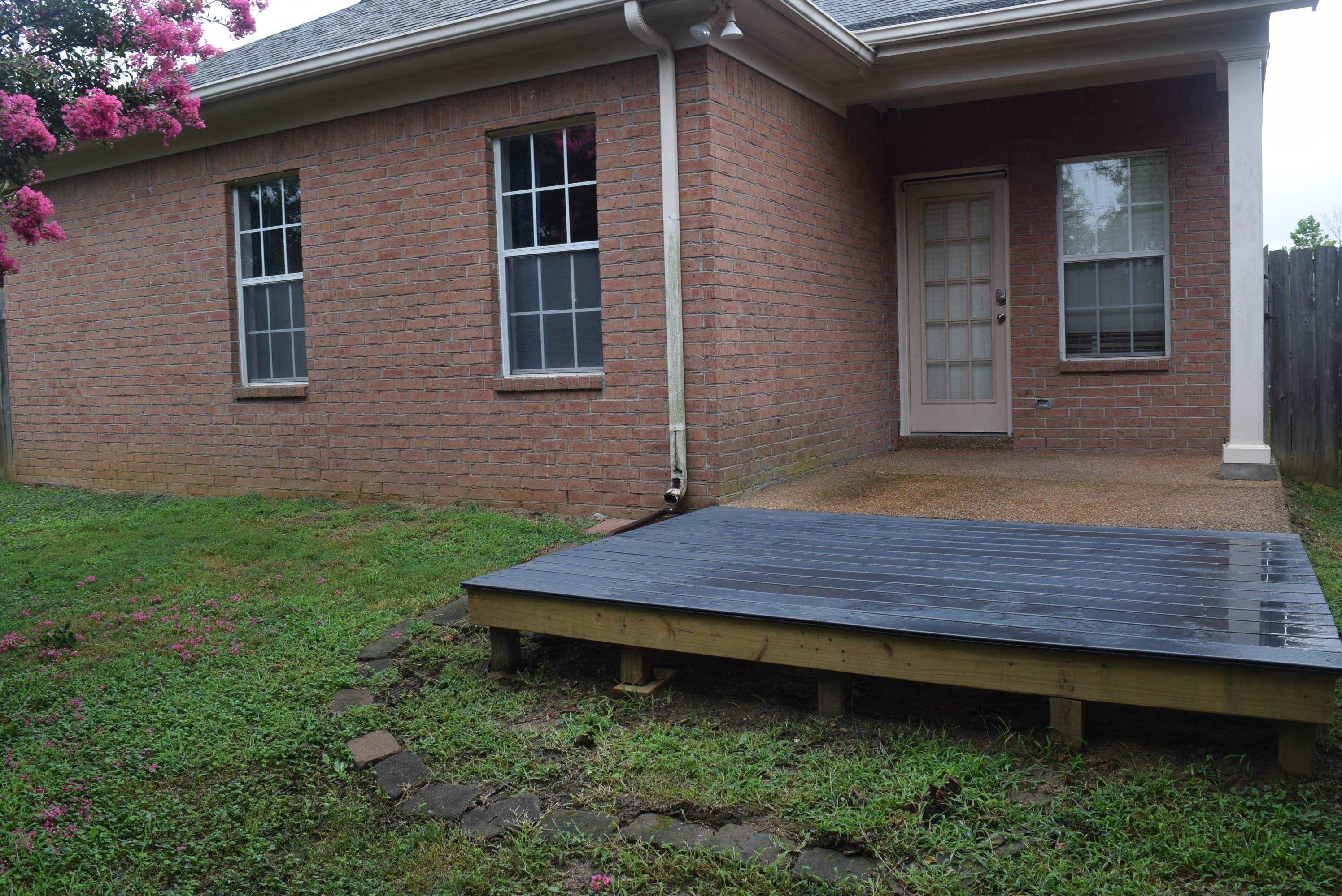 8739 Eagle View Drive Memphis, TN 38018 - Photo 15 of 18 a front view of a house with a garden