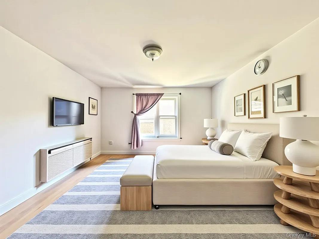 42-38 Judge Street, Unit 3A Queens, NY 11373 - Photo 3 of 9 Bedroom featuring light wood-type flooring and baseboards