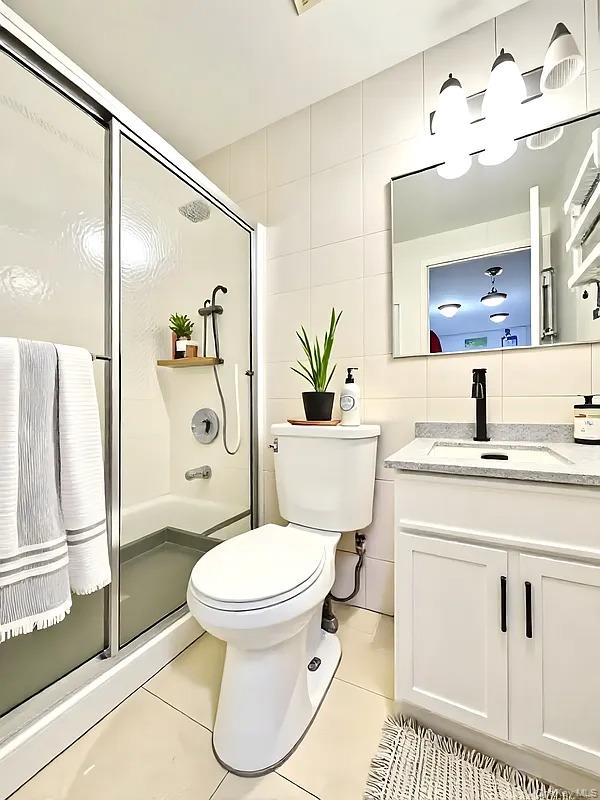 42-38 Judge Street, Unit 3A Queens, NY 11373 - Photo 6 of 9 Full bathroom with tile walls, a shower stall, vanity, light tile patterned flooring, and tasteful backsplash