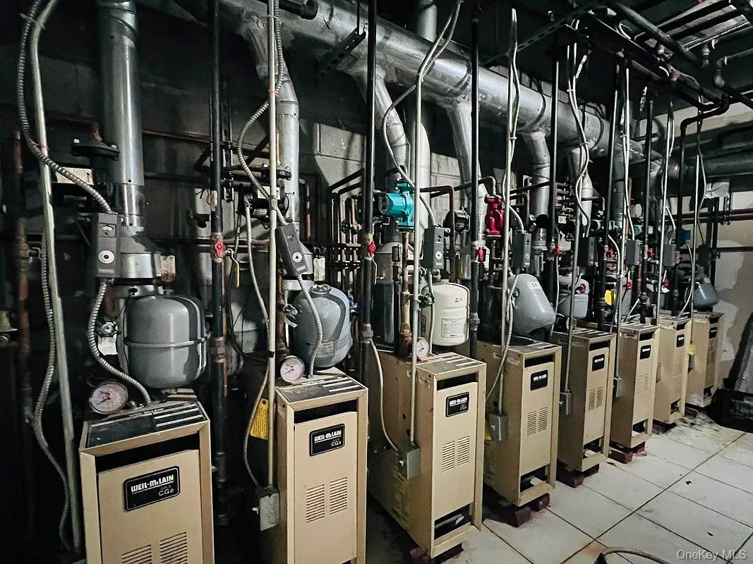 42-38 Judge Street, Unit 3A Queens, NY 11373 - Photo 9 of 9 Utility room featuring a heating unit