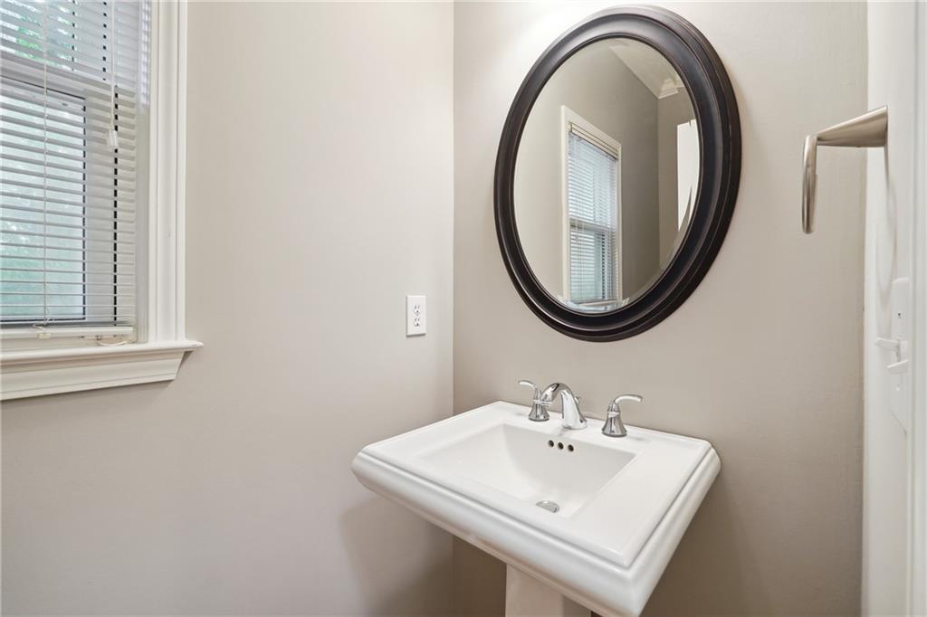 5145 Harbour Ridge Drive Alpharetta, GA 30005 - Photo 11 of 27 a bathroom with a sink and a mirror