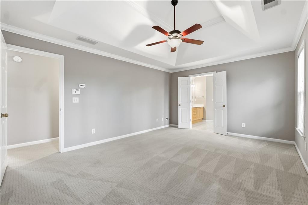 5145 Harbour Ridge Drive Alpharetta, GA 30005 - Photo 12 of 25 a view of an empty room with a chandelier fan