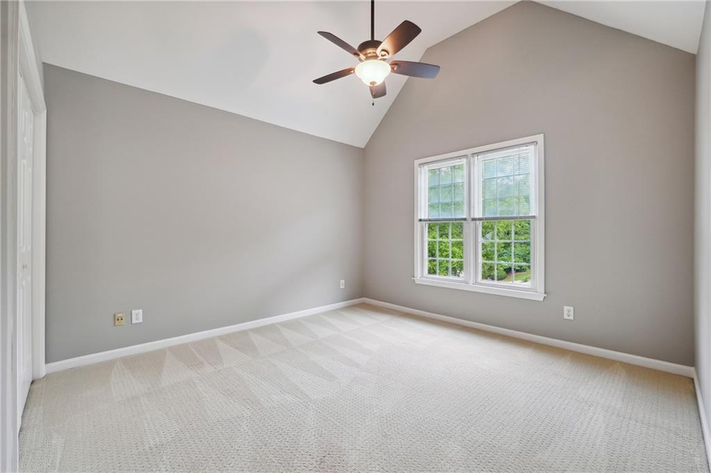 5145 Harbour Ridge Drive Alpharetta, GA 30005 - Photo 13 of 27 an empty room with a window and a fan