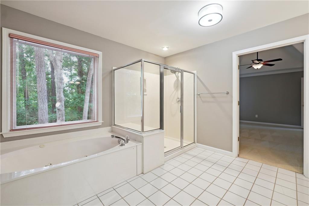 5145 Harbour Ridge Drive Alpharetta, GA 30005 - Photo 16 of 27 a bathroom with a bathtub and a shower