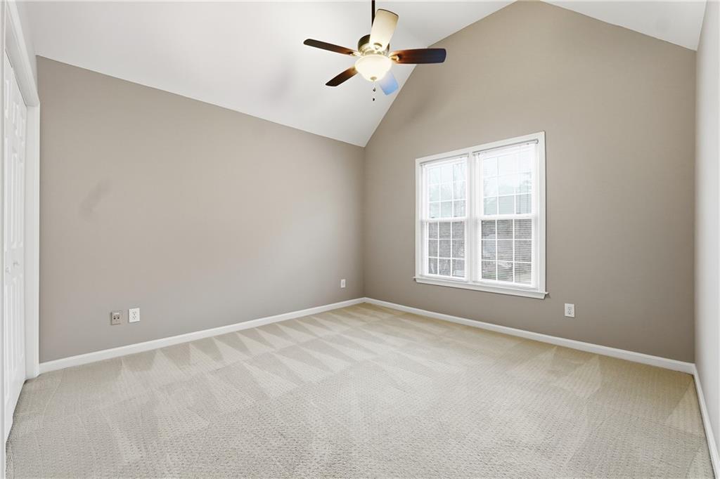 5145 Harbour Ridge Drive Alpharetta, GA 30005 - Photo 17 of 25 an empty room with windows and fan