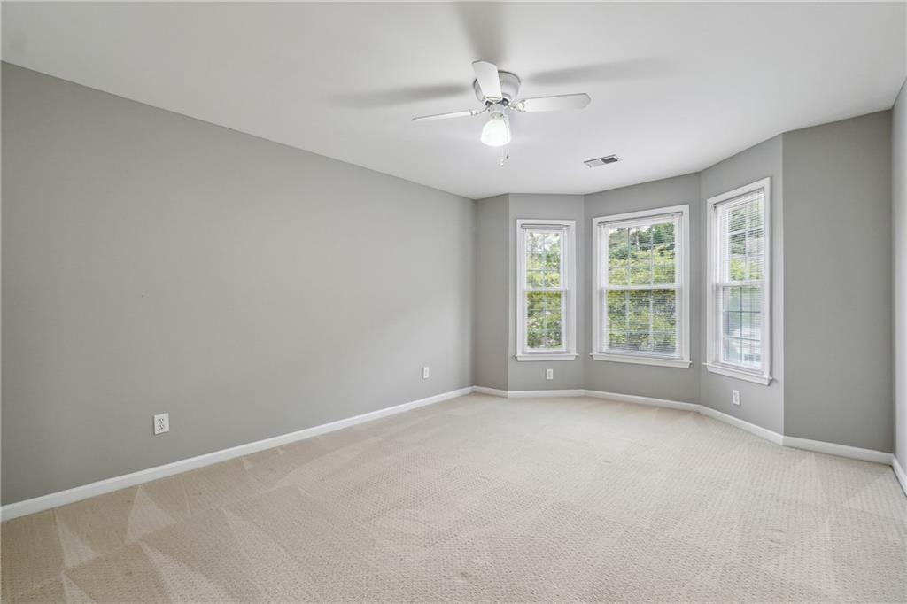5145 Harbour Ridge Drive Alpharetta, GA 30005 - Photo 17 of 27 a view of an empty room with windows