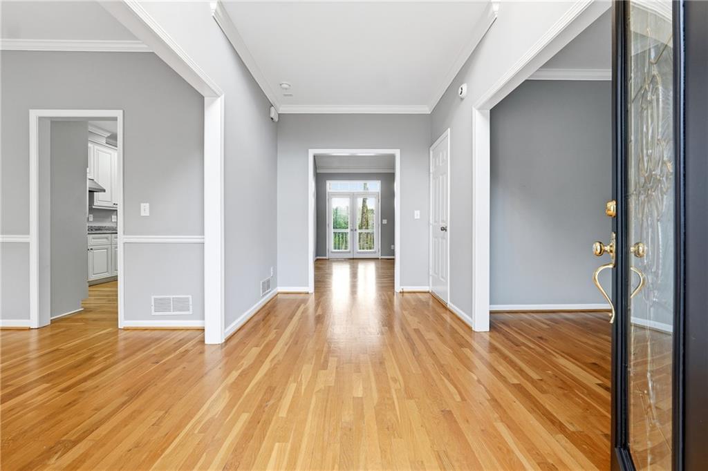 5145 Harbour Ridge Drive Alpharetta, GA 30005 - Photo 2 of 25 a view of a big room with wooden floor and windows