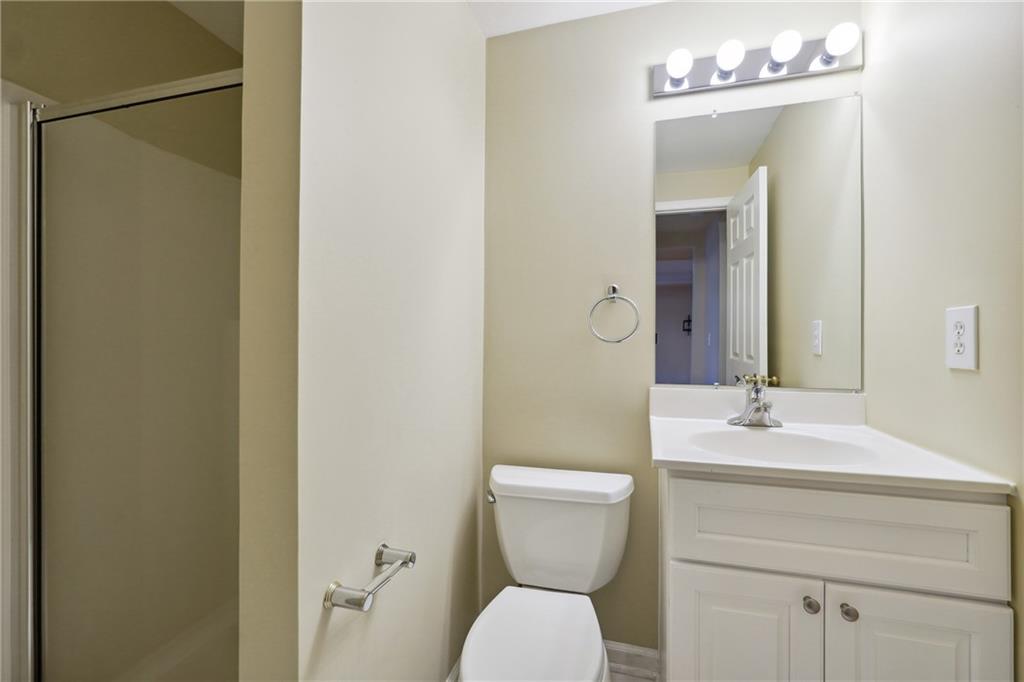 5145 Harbour Ridge Drive Alpharetta, GA 30005 - Photo 23 of 27 a bathroom with a sink vanity mirror and toilet