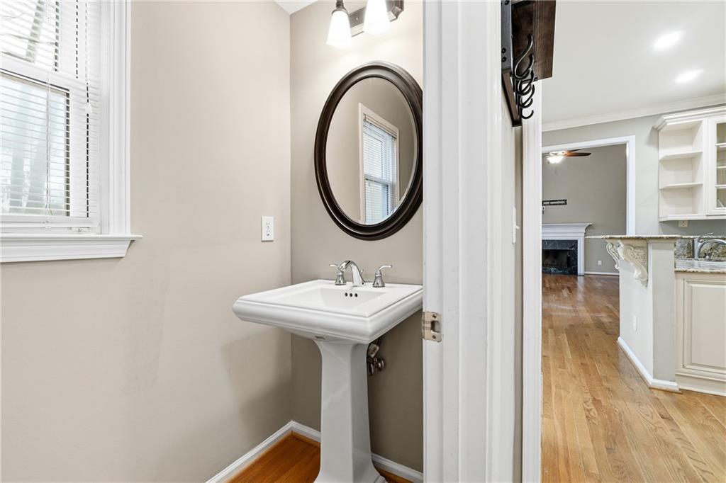 5145 Harbour Ridge Drive Alpharetta, GA 30005 - Photo 10 of 25 a bathroom with a sink a mirror and a shower