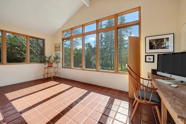 a view of a room with furniture and windows