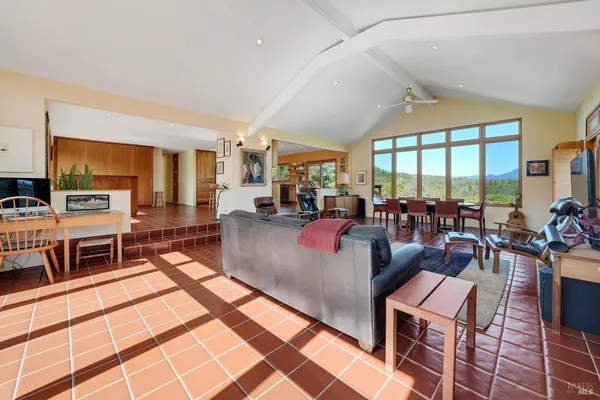 a living room with lots of furniture and a flat screen tv