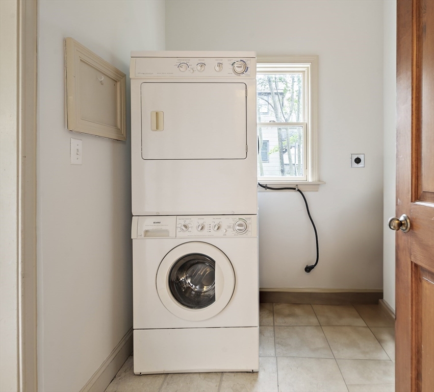 28 Summer Street, Unit 1 Somerville, MA 02143 - Photo 14 of 14 a utility room with dryer and washer